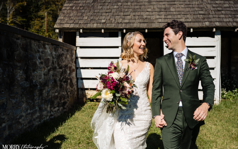 bride and groom smiling at eachother